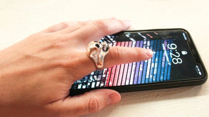 person wearing silver-colored ring