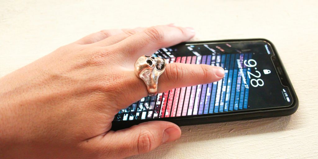 person wearing silver-colored ring