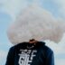 a person with a cloud on their head