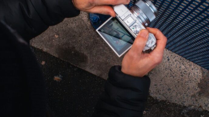 a person holding a cell phone in their hand