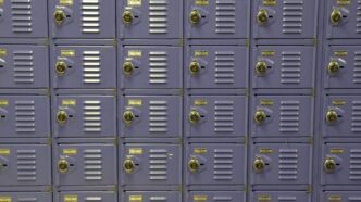 a wall of purple lockers with yellow tags on them