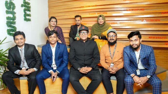a group of people sitting next to each other