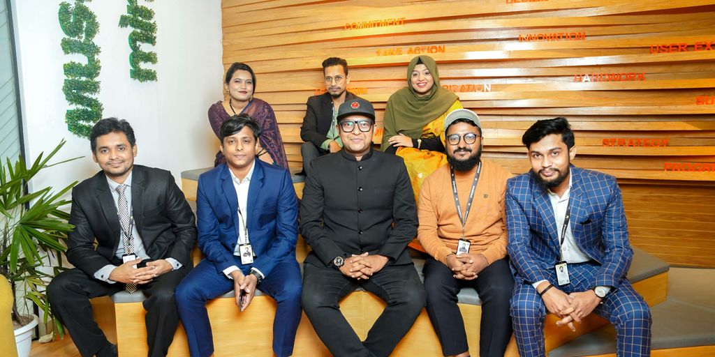 a group of people sitting next to each other