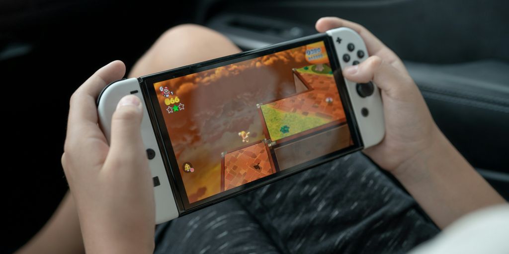a person holding a [UNK] [UNK] game [UNK]