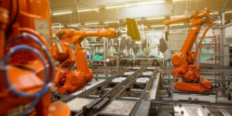 a factory filled with lots of orange machines