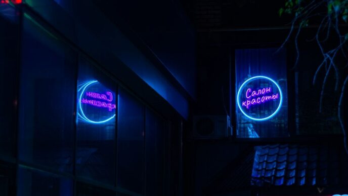 a building that has a neon sign on it