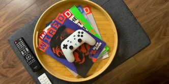 a remote control sitting on top of a wooden table