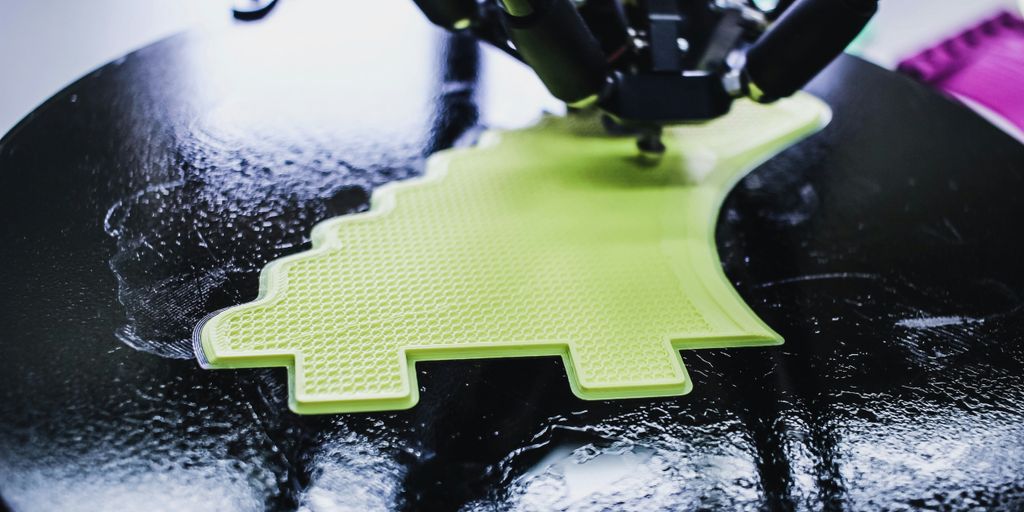 black printing machine printing on black and green pad