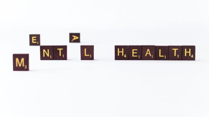 a set of wooden blocks spelling the word mental
