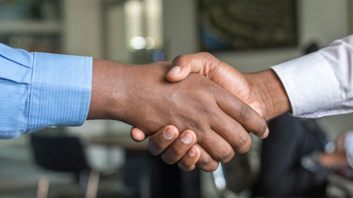 two people shaking hands