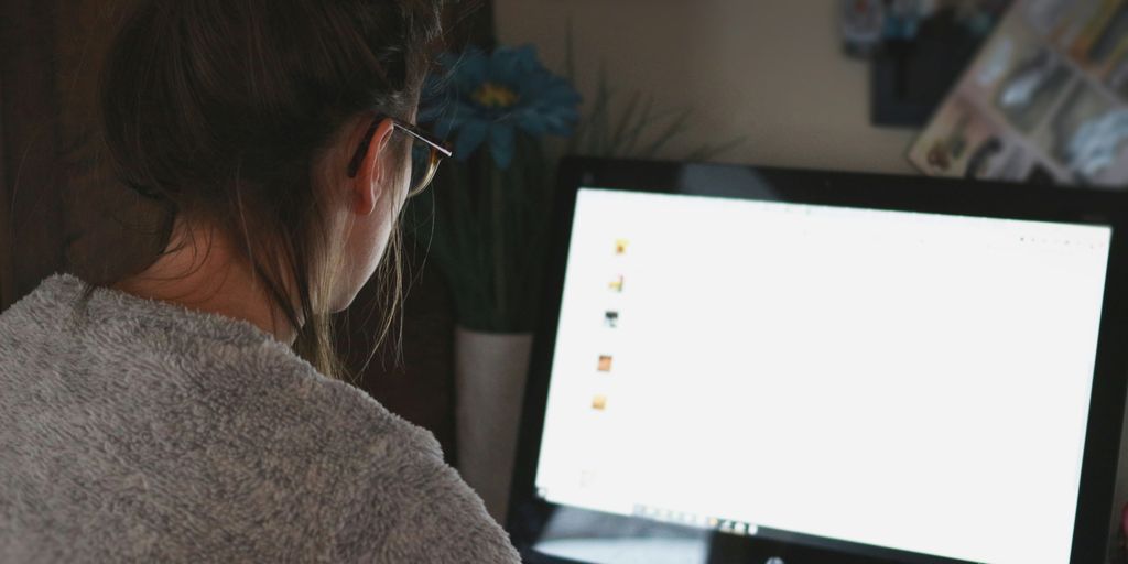 woman in front of computer monitor