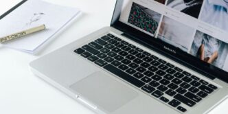 Macbook Pro besides white book