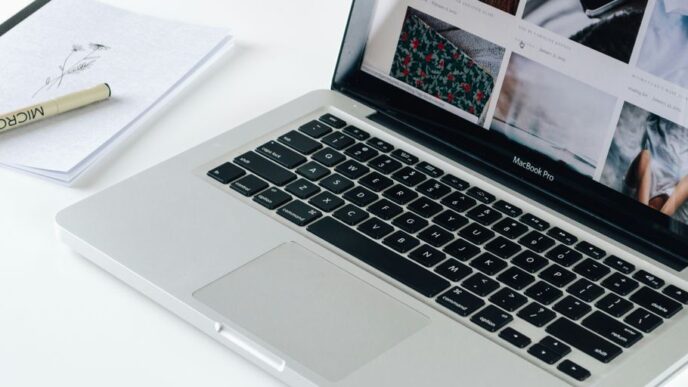 Macbook Pro besides white book
