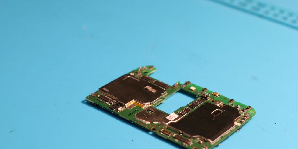 A mobile phone circuit board is seen up close.