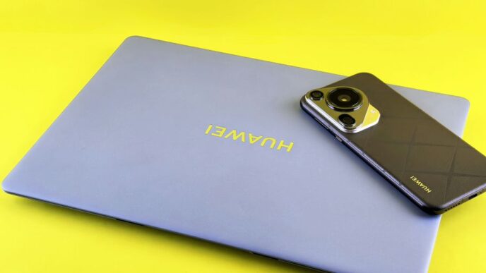 Laptop and smartphone on a yellow background