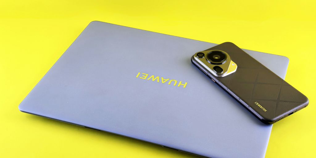 Laptop and smartphone on a yellow background