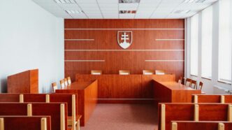 a room filled with wooden desks and chairs