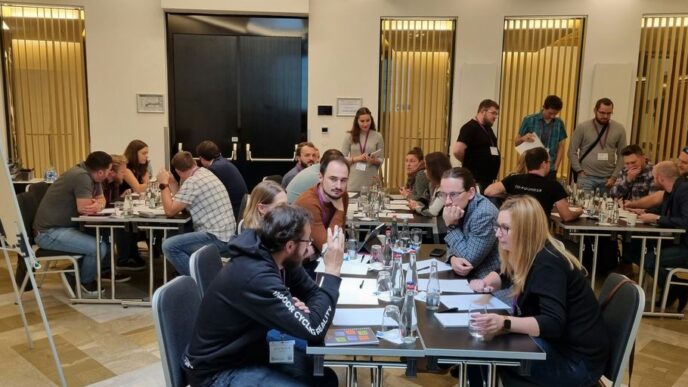 a group of people sitting around a table