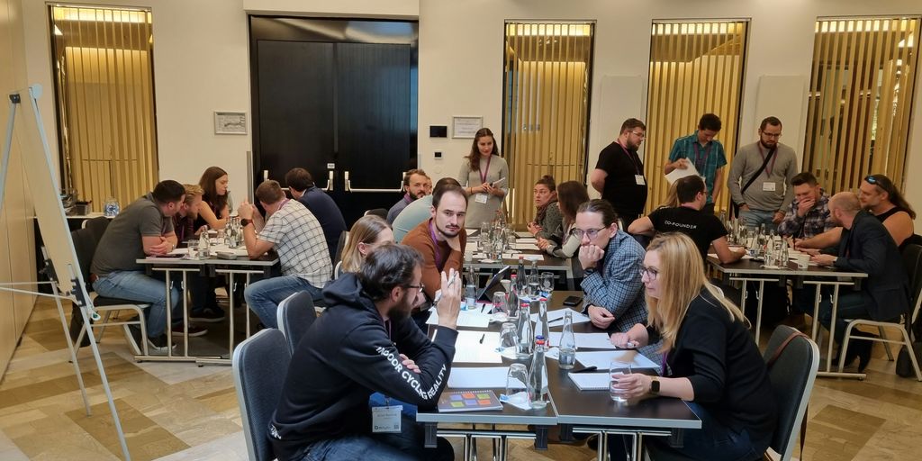 a group of people sitting around a table