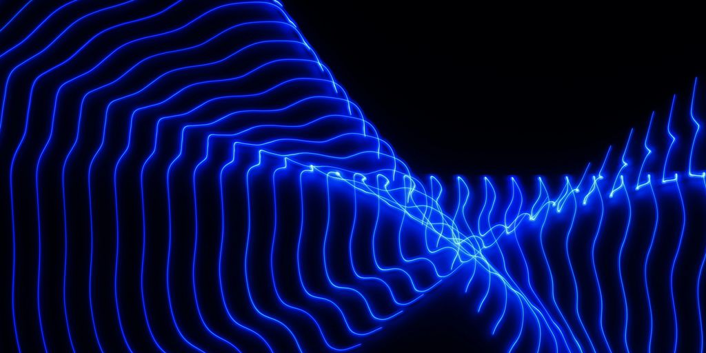 a blue wave of light in the dark