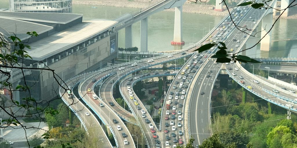 a view of a highway with a bridge in the background