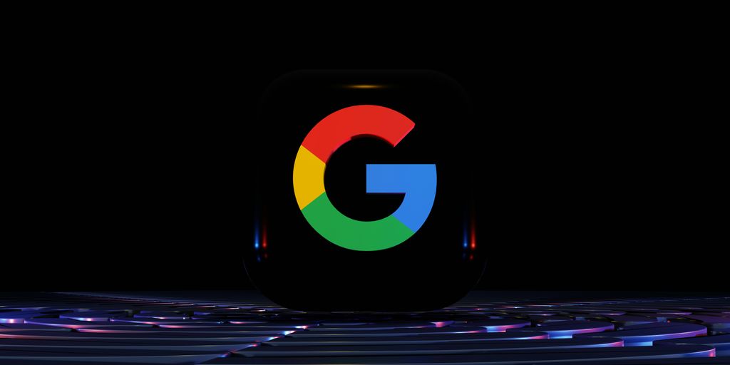 a close up of a computer keyboard with the google logo on it