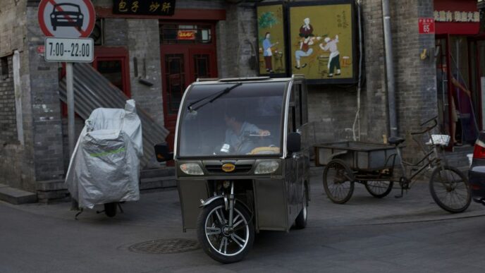 a baby stroller parked on the side of a street