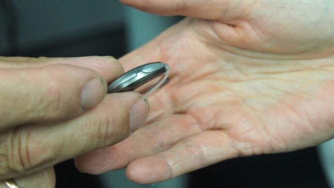 person holding silver nail cutter