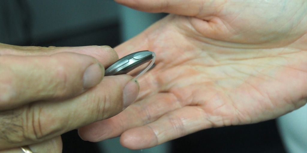 person holding silver nail cutter