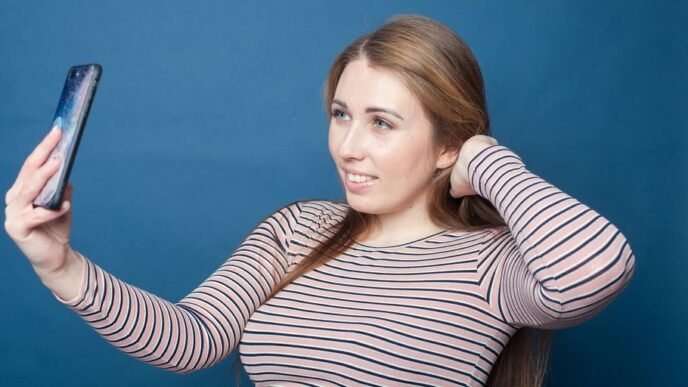 a woman holding a phone
