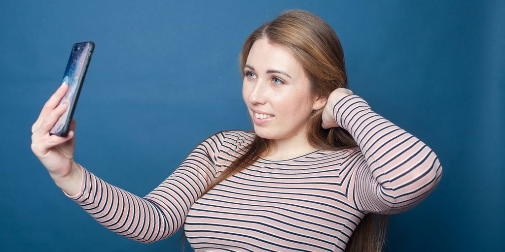 a woman holding a phone