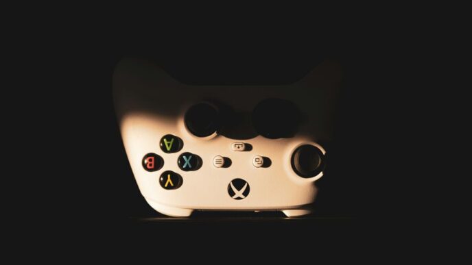 a close up of a video game controller in the dark