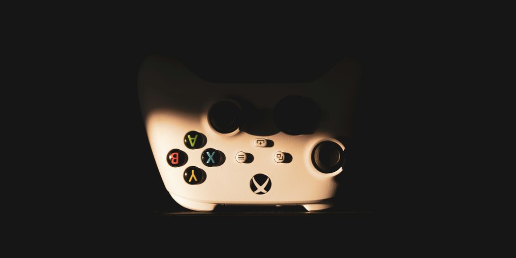 a close up of a video game controller in the dark