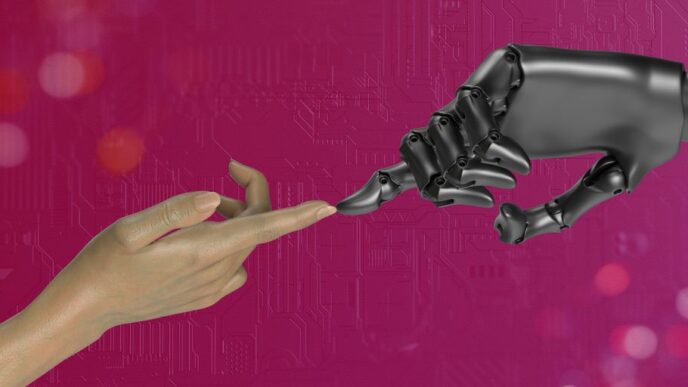 two hands touching each other in front of a pink background