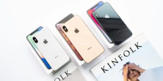 three assorted-color of iPhone Xs on boxes