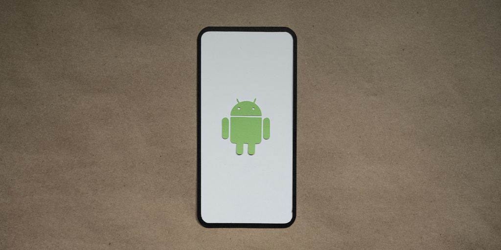 a cell phone with a green icon on it