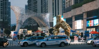 a giant statue of a giant creature in the middle of a city
