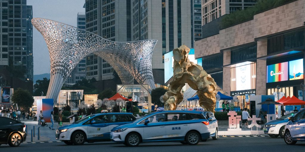 a giant statue of a giant creature in the middle of a city