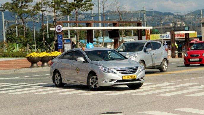 silver mercedes benz coupe on road during daytime