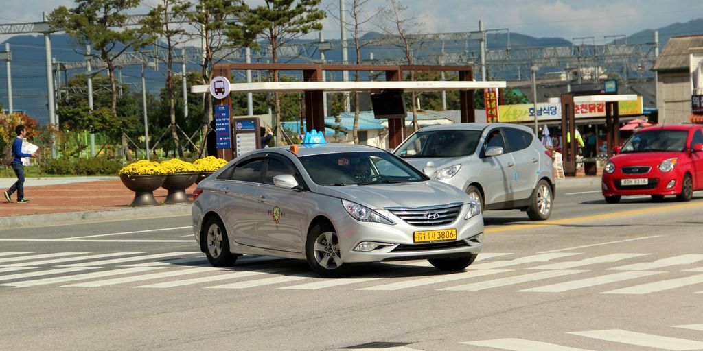 silver mercedes benz coupe on road during daytime