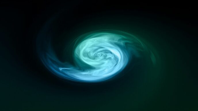 a green and blue swirl in the dark