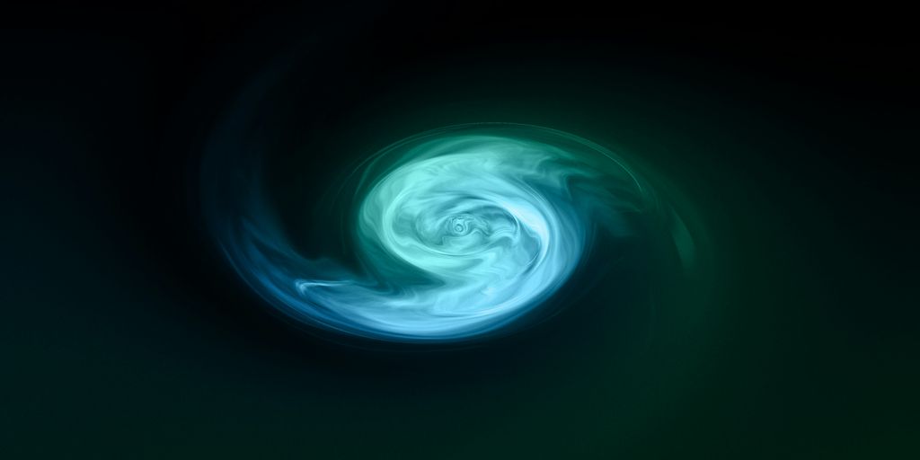 a green and blue swirl in the dark