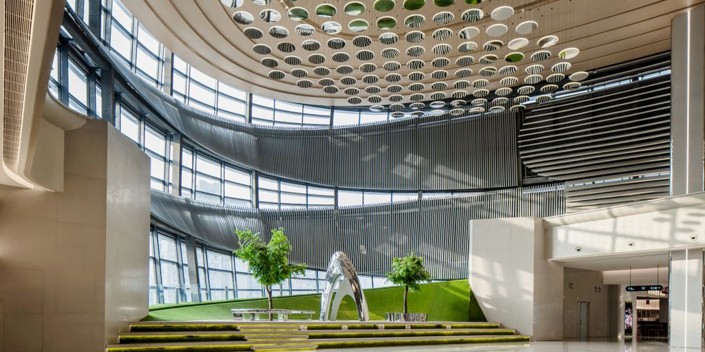 A large room with a sculpture in the middle of it