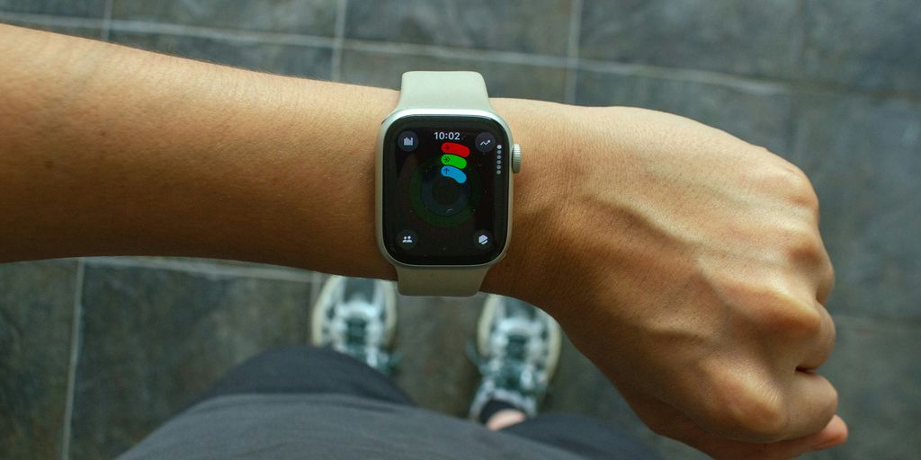 A wrist with an apple watch.