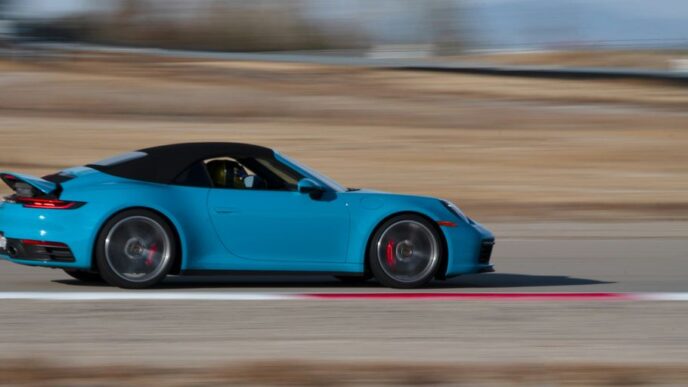 blue convertible coupe on road