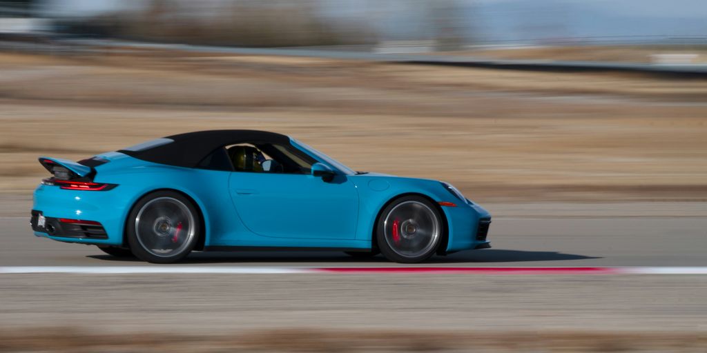 blue convertible coupe on road
