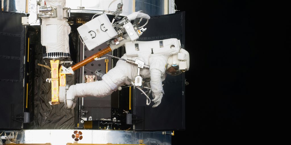 a space station with a space shuttle attached to it