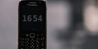 black nokia qwerty phone at 12 00