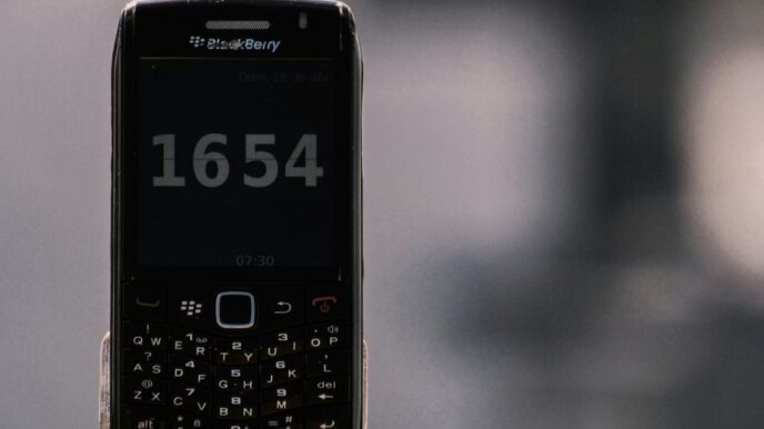 black nokia qwerty phone at 12 00