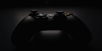 shallow focus photography of black Xbox controller